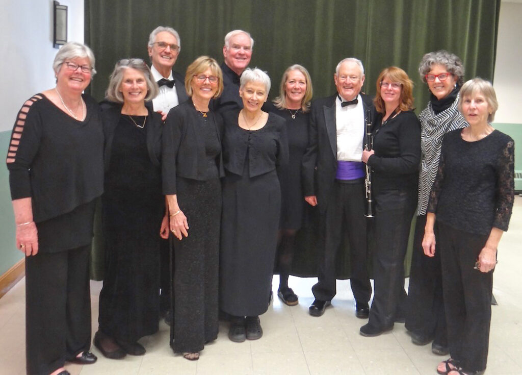 Rufus Patrick, center, with purple cumberbund, and other members of the Hinesburg Orchestra.